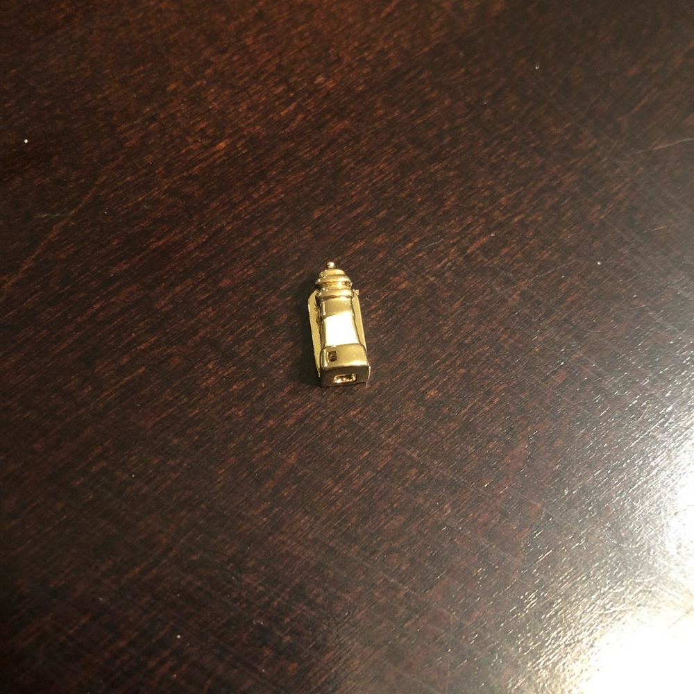 Keep collective gold lighthouse charm